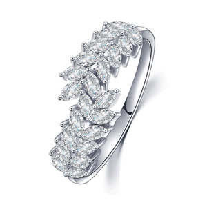 Detailed macro view of marquise cut gemstones in a leaf design on a silver ring