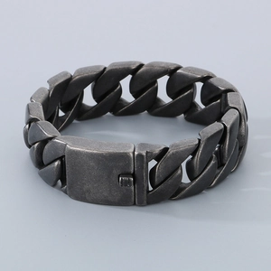 Detail of matte dark grey Cuban link bracelet with square box clasp for men