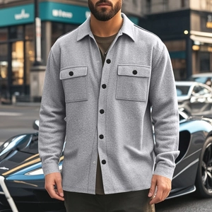 Close-up of grey slim-fit shacket featuring chest pockets and classic button closure