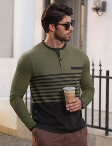 Close-up of olive green long sleeve Henley shirt with black chest stripe and button collar