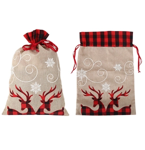 Detail of burlap Christmas gift bags featuring red black buffalo plaid deer and snowflakes