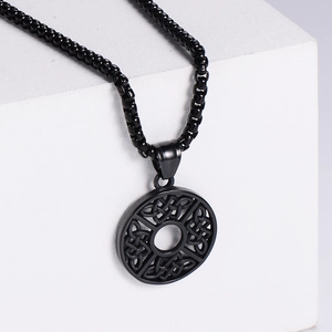 Black Celtic knot round pendant necklace with box chain on white display stand