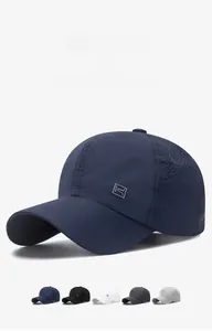 Close-up of laser-cut ventilation holes and rubber logo on a quick-dry baseball cap