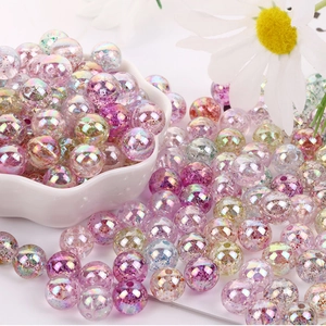 Macro shot of 8mm pink purple acrylic AB glitter round beads for DIY jewelry making