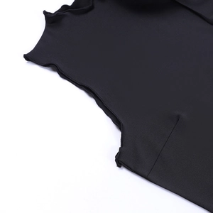 Close-up of black sleeveless top showing lettuce edge neckline and knit fabric texture