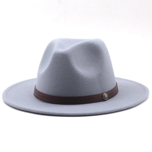 Detail of light blue wool felt fedora featuring a brown band and metal badge ornament