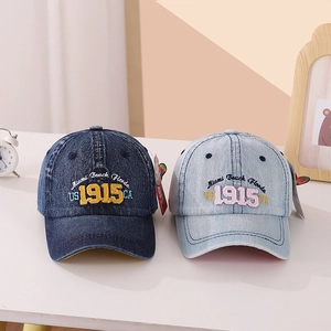 Detail of vintage denim baseball caps showing Miami Beach embroidery in blue shades