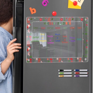 Magnetic acrylic weekly planner board on fridge with six colorful markers and flowers