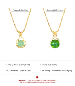 Detail view of vintage alloy necklaces with green stones and 51cm chain specifications