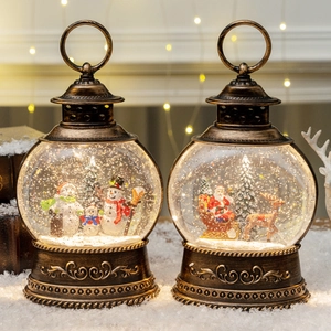 Vintage bronze Christmas lanterns with snow globe scenes and elegant LED lighting