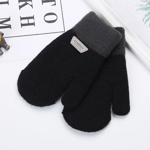 Detailed knit texture of children striped winter gloves with a fashion collection label