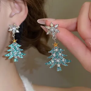 Elegant silver Christmas tree earrings with sparkling green crystals and white pearls