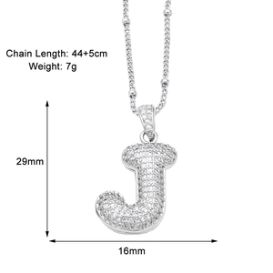 Detail of letter J pendant necklace with dimensions 29mm x 16mm and chain length 44+5cm