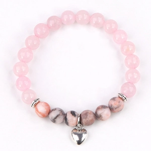 Pink zebra stone beaded bracelet featuring 8mm round beads and a silver heart charm