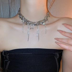 Silver Y2K star pendant necklace with sparkling rhinestone tassels and layered chains