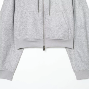 Women's grey zip-up hoodie featuring puff sleeves and soft fleece fabric in a relaxed fit