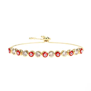 Detail of red enamel evil eye bracelet with clear zircons and adjustable slider clasp