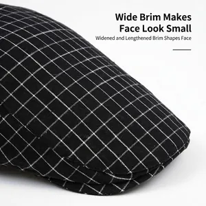 Classic black and white checkered flat cap with a wide brim and textured fabric