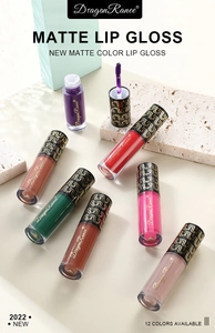 Flat lay of twelve matte liquid lipsticks in diverse shades on stones with gold branding