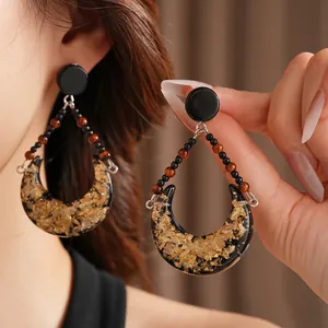 Vintage crescent resin earrings with gold foil accents and beaded drop design for women