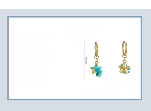 Detail view of 18K gold plated stainless steel star earrings with turquoise stone