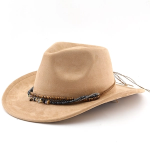 Detail of bohemian fedora hat featuring camel suede texture and handmade beaded band