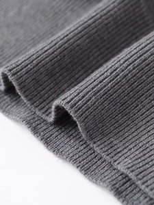 Macro shot of gray ribbed knit fabric texture with high quality fiber detail