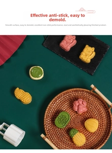 Detailed view of non-stick press molds creating pineapple cakes and mung bean pastries