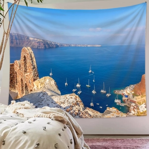 Bedroom wall decor showing Santorini seascape tapestry with blue ocean and white sailboats