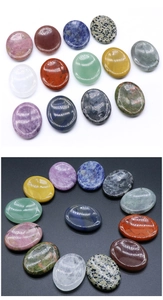 Collection of various colorful oval gemstone worry stones for facial gua sha massage