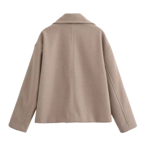 Back view of a camel wool short jacket showing premium textured fabric and neat tailoring