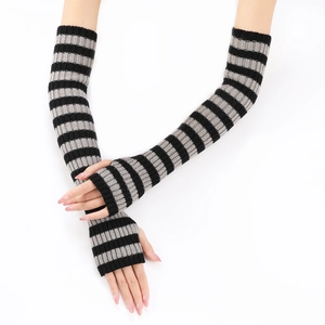 Close-up of black and grey striped knitted arm warmers with elastic wool blend texture