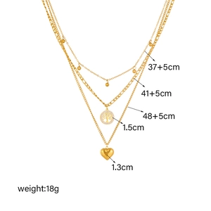 Gold multi-layer necklace with Tree of Life and heart charms on triple stainless steel chains