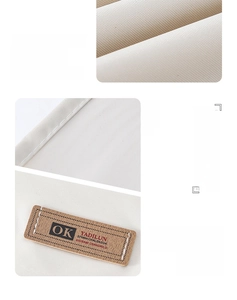 Detail of waterproof cream fabric with brown leather logo tag and tight stitching