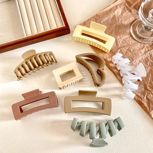 Set of 8 large resin hair claws in matte colors including beige, brown and green