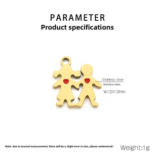 Macro detail of golden stainless steel boy and girl pendant charm with red heart icon