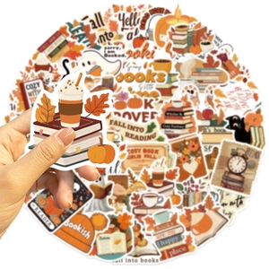 Close-up of fall-themed bookish stickers featuring pumpkins, coffee, and cozy autumn vibes