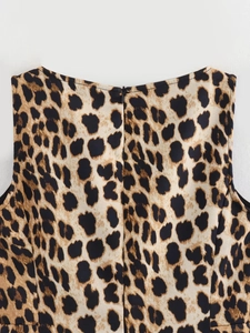 Close-up of leopard print summer dress showing the crew neck and hidden back zipper detail