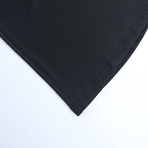 Detailed view of the fine stitching and high-quality black fabric of the evening dress