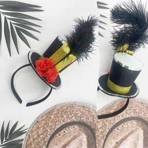 Detail of mini black glitter top hat headband with red roses and elegant feathers