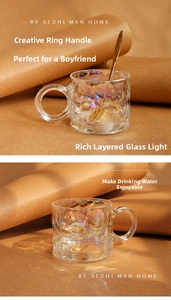 Close-up of iridescent hammered glass mug with creative circular handle and golden spoon