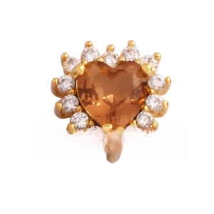 Detail of heart-shaped gold earring with amber center stone and white zircon halo