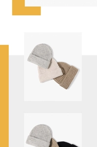 Detailed ribbed knit texture of thick winter beanies in neutral gray and beige colors