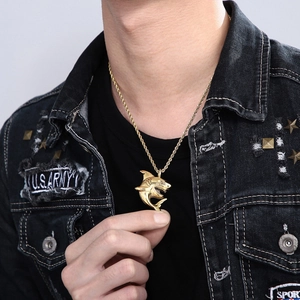 Hip hop style gold shark pendant necklace in stainless steel shown on model
