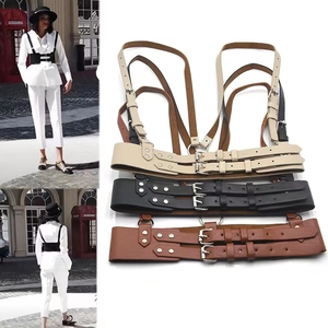 Three-color display of leather body harness straps in beige, black and brown options