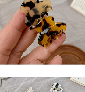 Mini acetate hair claws in tortoiseshell and marble patterns for side hair styling