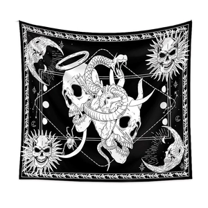 Close-up of black and white gothic tapestry featuring skull, snakes, and sun symbols