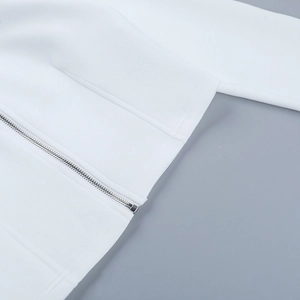 Close-up of high-quality silver metal zipper and white knit fabric on street style hoodie