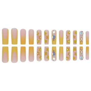 Long coffin yellow French press-on nails with 3D floral accents and rhinestones
