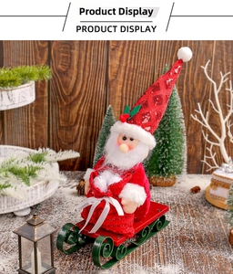 Detail of plush Santa Claus doll with red sequin hat on a vintage metal sled decoration